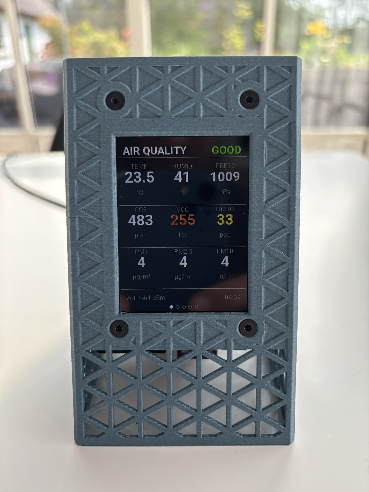 Front view of the Airnode unit with display and enclosure fasteners.